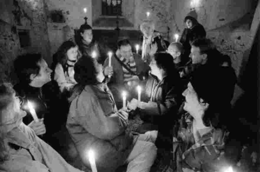 Canterbury Tales photo: actors holding candles inside the Leper Chapel