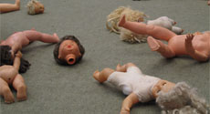 Macbeth photo: the stage floor scattered with dismembered dolls